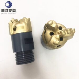 What materials are commonly used to manufacture drill bits for water well drilling?